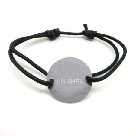 cord bracelet with custom metal charm