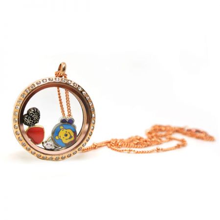 gold floating locket with stones
