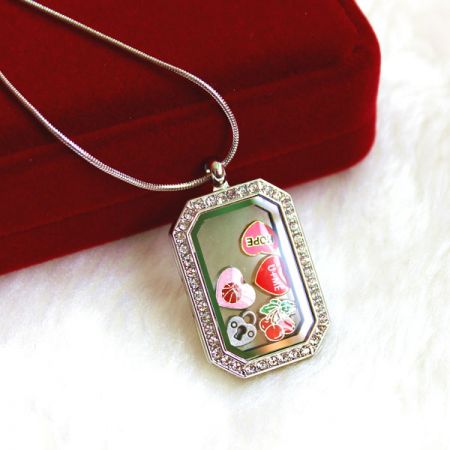 polygonal locket with floating charms