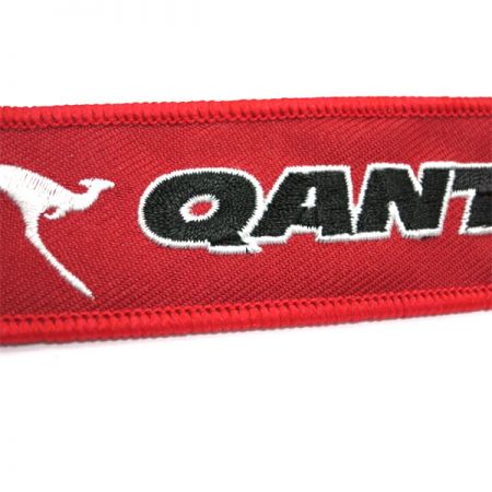 embroidered remove before flight keyrings