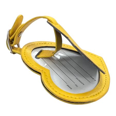 Желтая бирка для багажа из PU-кожи.