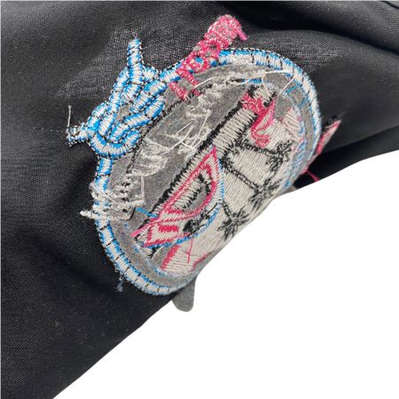 the back side of the embroidered details on a neckerchief