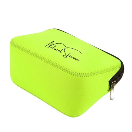 Bright green neoprene makeup pouch with black zipper and custom logo printing for skincare brand