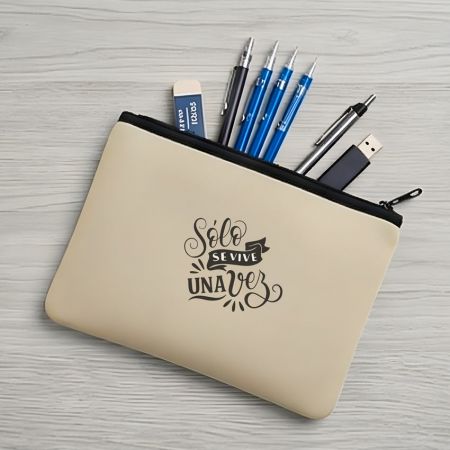 Beige neoprene cosmetic pouch used as a stationery organizer, holding pens, USB drive, and accessories