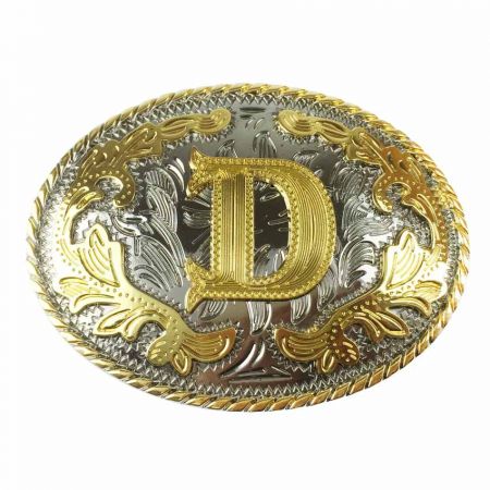 Sinkki-seos vyönsolki, jossa kultainen D hopeataustalla