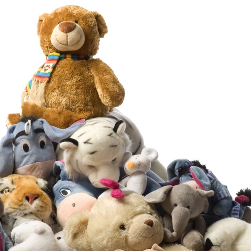 personalized plush animals stacked in a pile