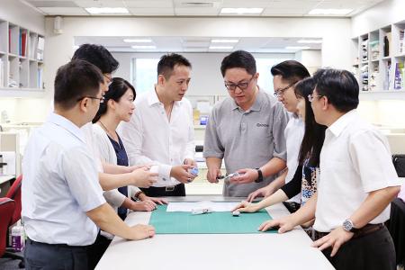 R&D engineers were discussing an OEM project with sales team.