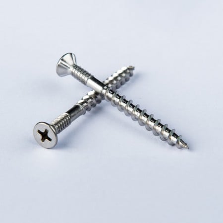 Flat Head Phillips Drive Tapping Screw - Flat head Phillips Drive Tapping Screw w/ 4 Ribs under the Head and Collated.