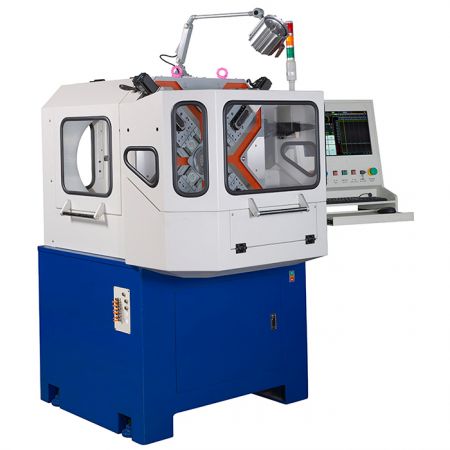The X-type spring forming machine with safety cover closed.