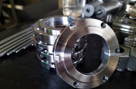 Precision Hardware - A batch of precision-machined steel and metal flanges and ring components, produced via our specialized custom CNC solutions.