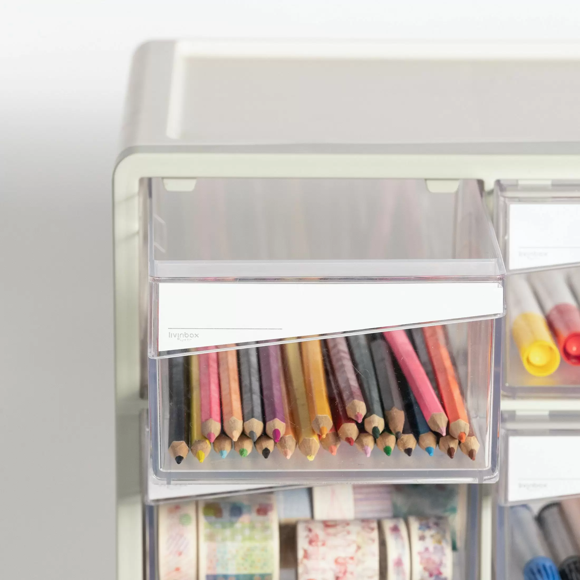 Asymmetrical handle and drawer label