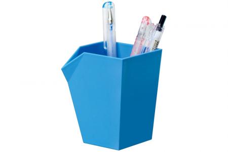 Pen and pencil holder in blue in use.