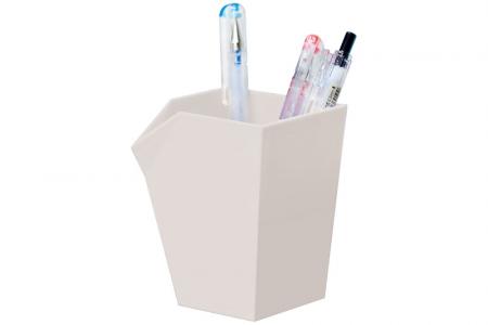 Pen and pencil holder in white in use.