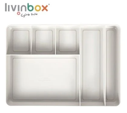 Pengatur laci meja rapi dengan 6 kompartemen berwarna beige.