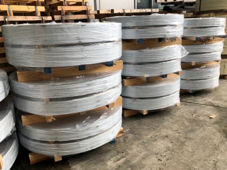 Export packaging for 430 stainless steel strips, with the use of white protective film and transparent protective film wrapped around the outer layer.