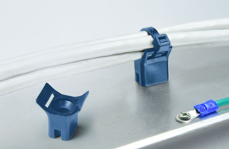 Suportes de amarração de cabo detectáveis por metal