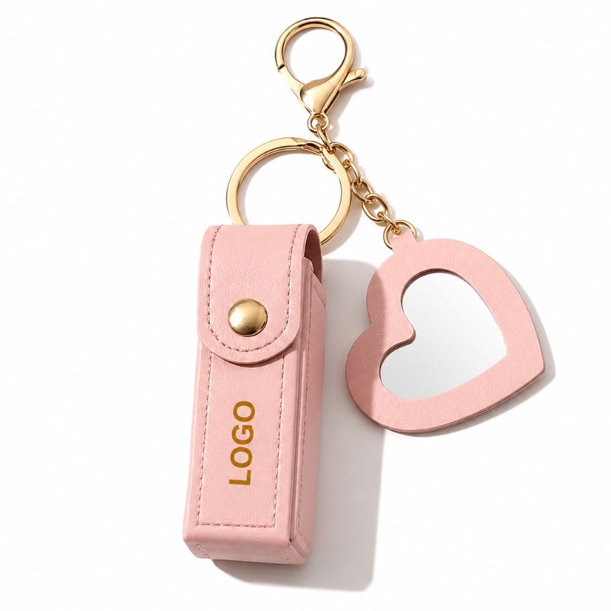 Pink leather lipstick case keychain with heart mirror, custom logo printed for cosmetic brand promotional gifts.
