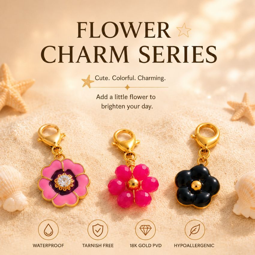 Waterproof 18k gold PVD flower charm series on beach sand, highlighting tarnish-free jewelry wholesale manufacturing.
