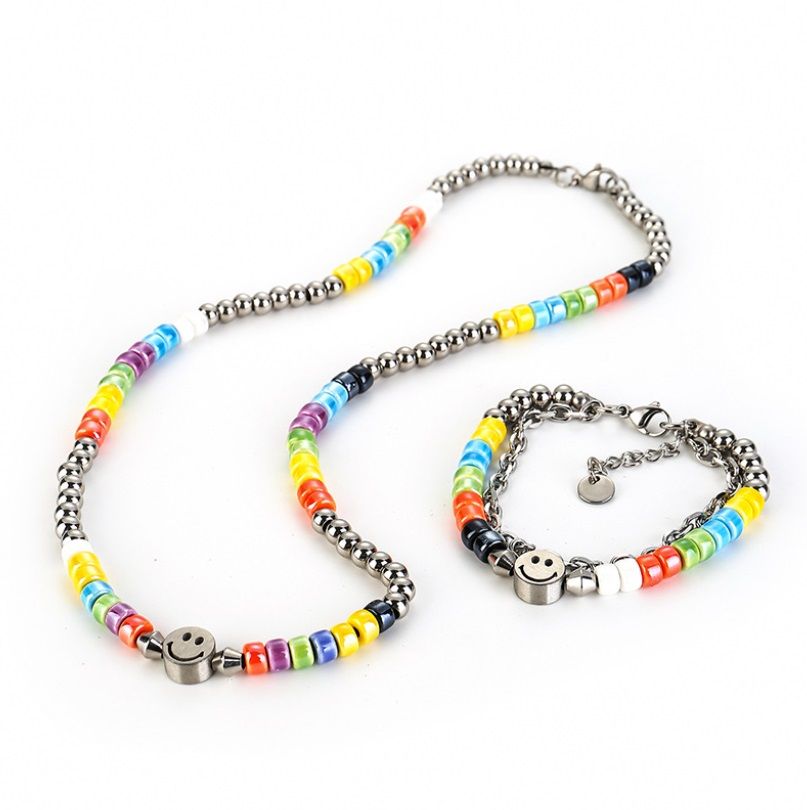 A pair of Rainbow LGBT Pride beaded bracelets made with colorful seed beads and featuring cheerful smiley face charms, representing inclusivity and joy.