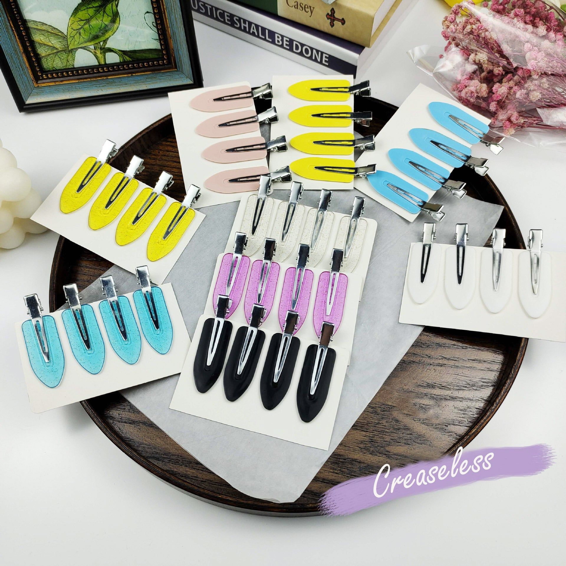 A vibrant display of wholesale creaseless flat hairpin clips in multiple colors, neatly arranged for retail.