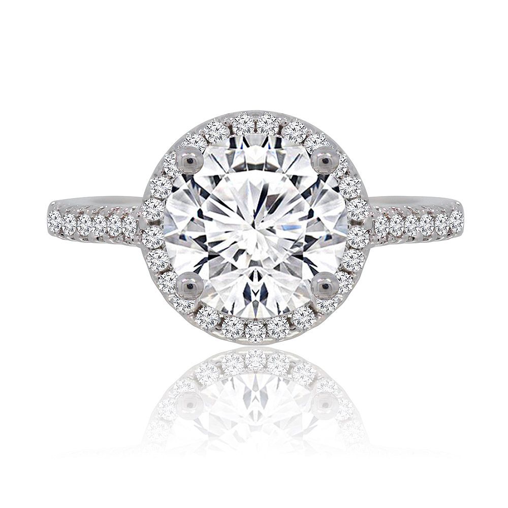 A close-up of the Unique Forever Engaged Ring, showcasing a brilliant 8mm round cubic zirconia center stone surrounded by a sparkling halo, set on a rhodium-plated brass band.