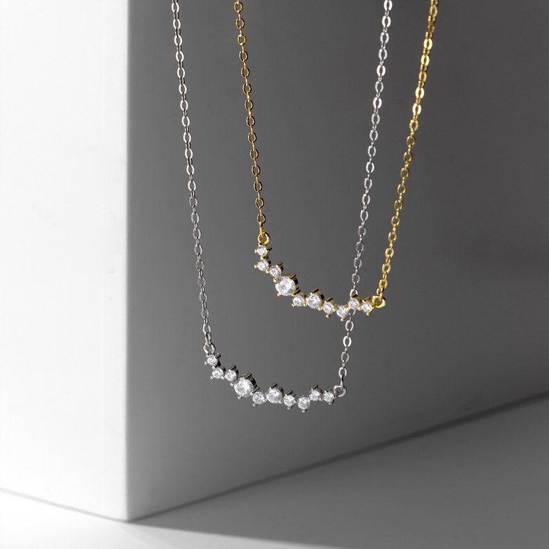 A set of 925 sterling silver smile choker necklaces with cubic zirconia, shown in both gold and silver finishes on a neutral background.