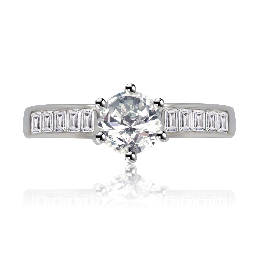 Close-up of the Band of Bling Ring, a rhodium-plated wedding band featuring a central round-cut cubic zirconia surrounded by sparkling emerald and baguette-cut stones.