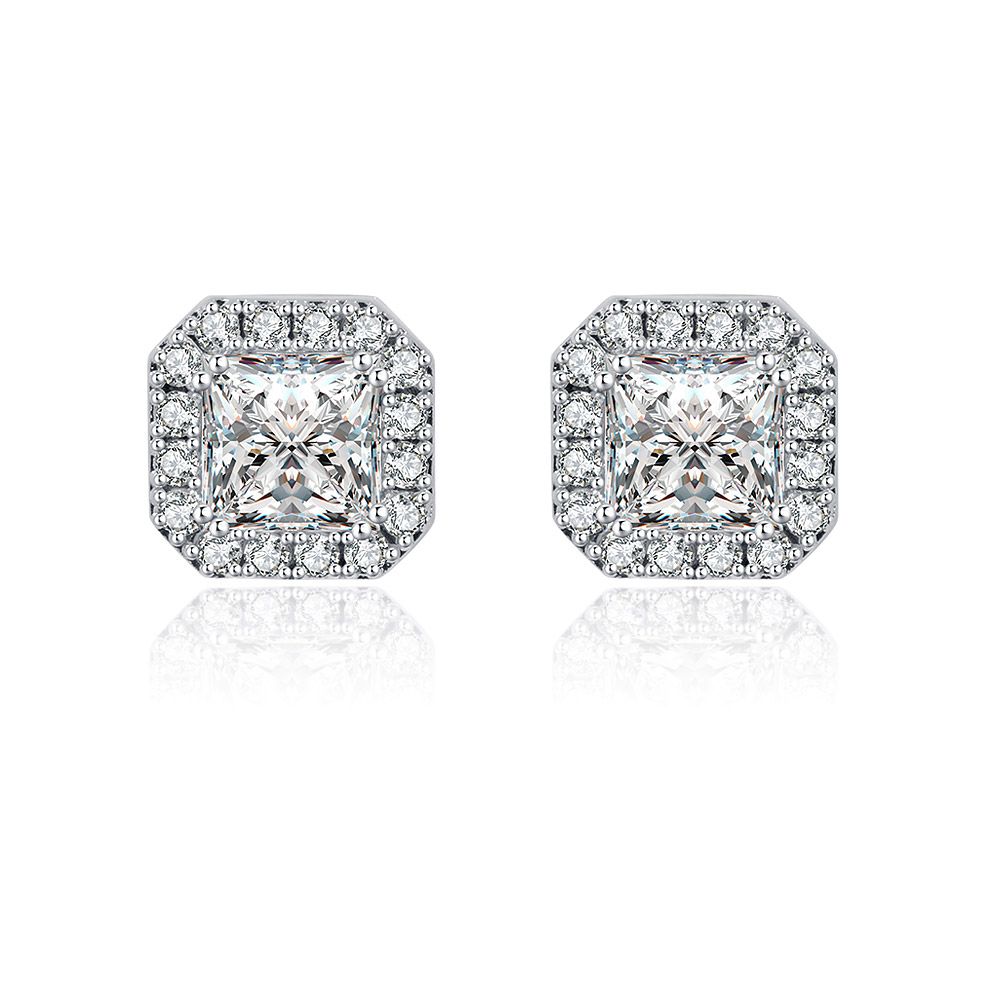 A pair of Mini Zirconia Cushion Stud Earrings featuring square-cut center stones with a halo design, crafted in rhodium-plated brass.