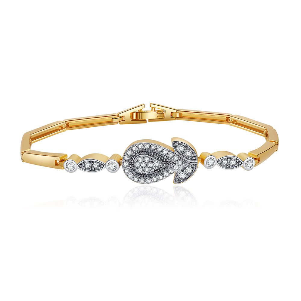 The Flower Two Tone Bar Bracelet featuring a gold band and a central teardrop decoration set with clear cubic zirconia stones on a white background.