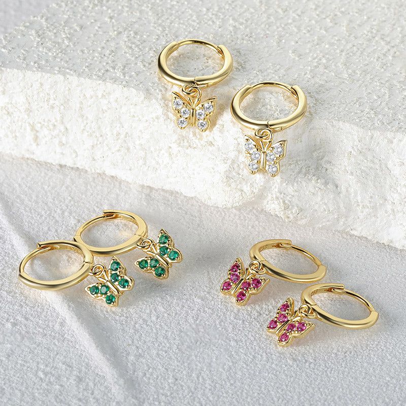 A stunning set of 925 sterling silver butterfly drop earrings with clear, green, and pink zircon gemstones, displayed on a white background.