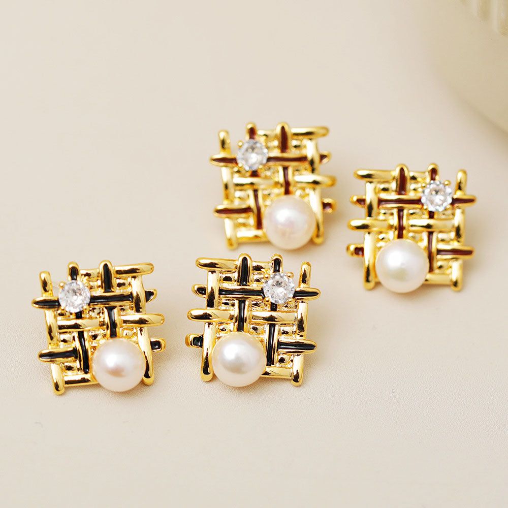 A close-up of the Braided Mesh Pearl Enamel Stud Earrings, showcasing the intricate gold lattice design with a central pearl and a sparkling clear gemstone.