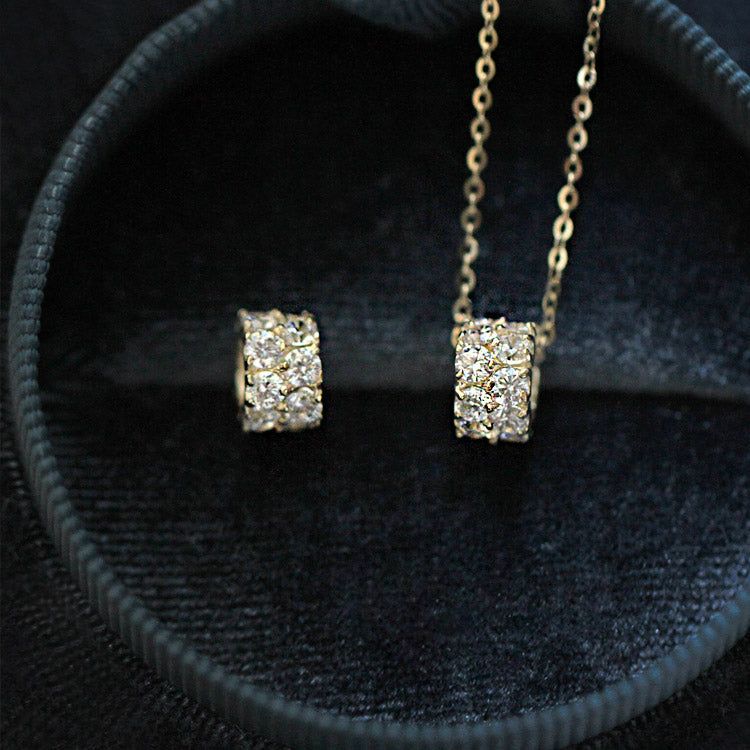 A stunning set of five 925 sterling silver choker necklaces with geometric zircon pendants, displayed in a luxurious gold finish.