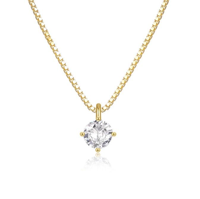 Collar colgante solitario de plata esterlina 925 con un acabado dorado y una piedra de circonio cúbico redonda, exhibido sobre un fondo blanco.