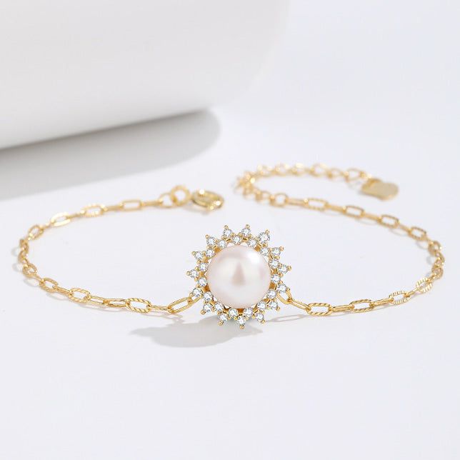 A stunning 925 sterling silver bracelet from a set of five, featuring a delicate paper clip chain, a lustrous single pearl, and a sparkling zircon stone.