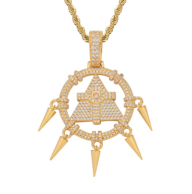 A close-up of the Custom Millennium Wheel Wisdom Necklace in a gold finish, featuring a detailed triangular pendant with spikes and encrusted with cubic zirconia stones.