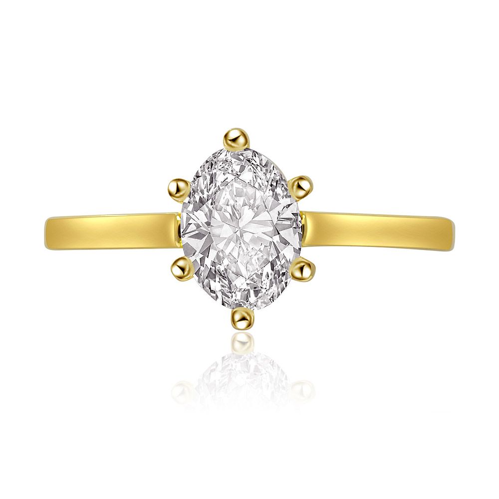 Elegant oval cut solitaire ring with a grooved gold band, featuring a sparkling white cubic zirconia stone.