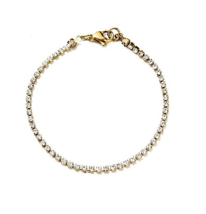 Primer plano de una pulsera de tenis de acero inoxidable chapada en oro (JRH-027) con una fila de brillantes cristales claros.