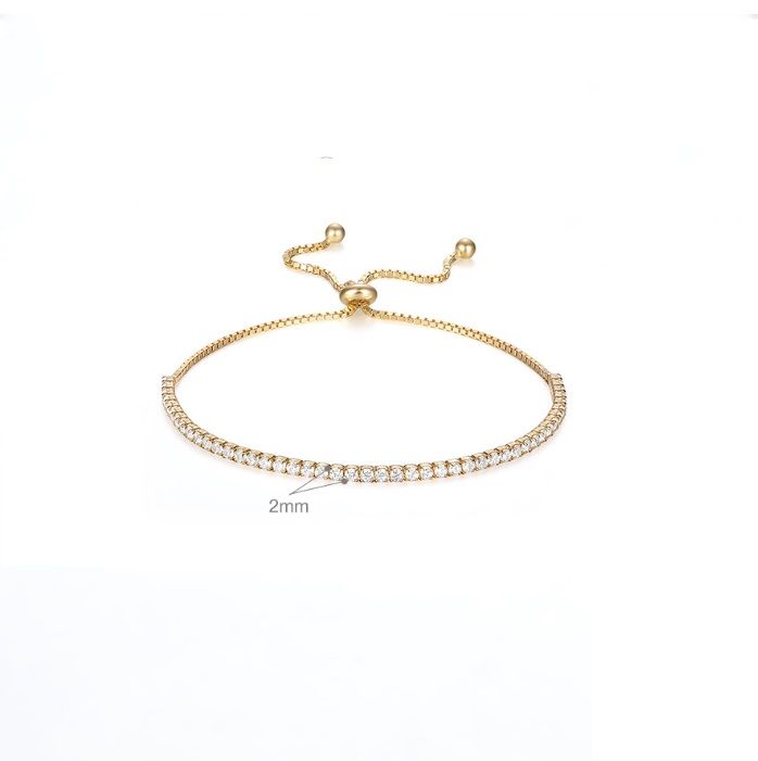 Close-up of the 925 Sterling Silver CZ Adjustable Tennis Bracelet in gold plating, highlighting the sparkling cubic zirconia stones and the adjustable sliding ball closure.