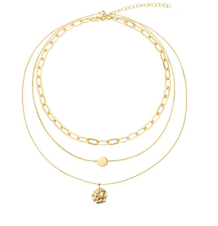 A close-up of the Layered Gold Chain Necklace in a polished gold finish, showcasing its three delicate layers and a central flower-shaped pendant.