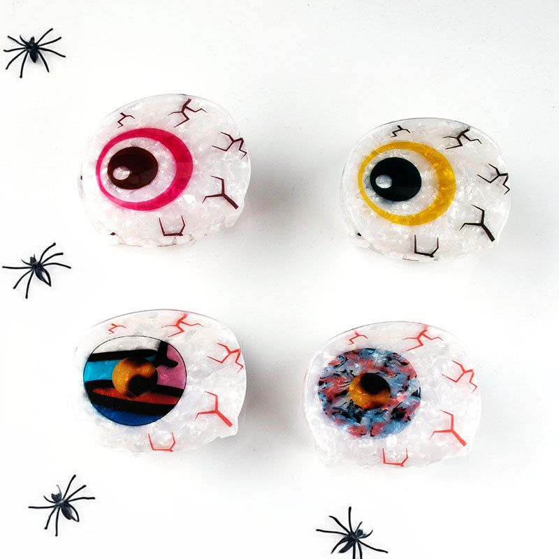 Ein Set aus vier bösen Augen Haarklammern in verschiedenen Farben, das ihr einzigartiges und stilvolles Design für Frauen und Mädchen zeigt.