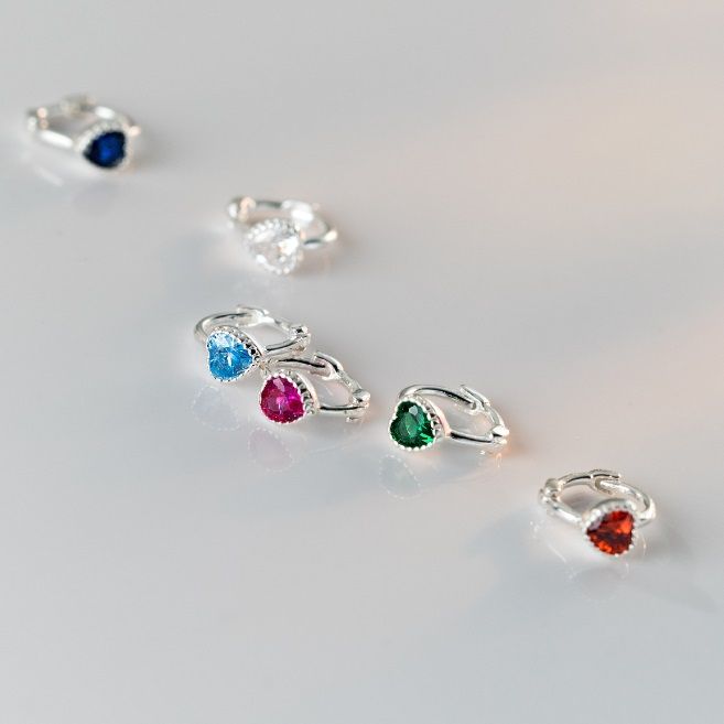 A collection of 925 sterling silver hoop earrings showcasing interchangeable cubic zirconia stones in various vibrant colors, including red, blue, green, and clear.