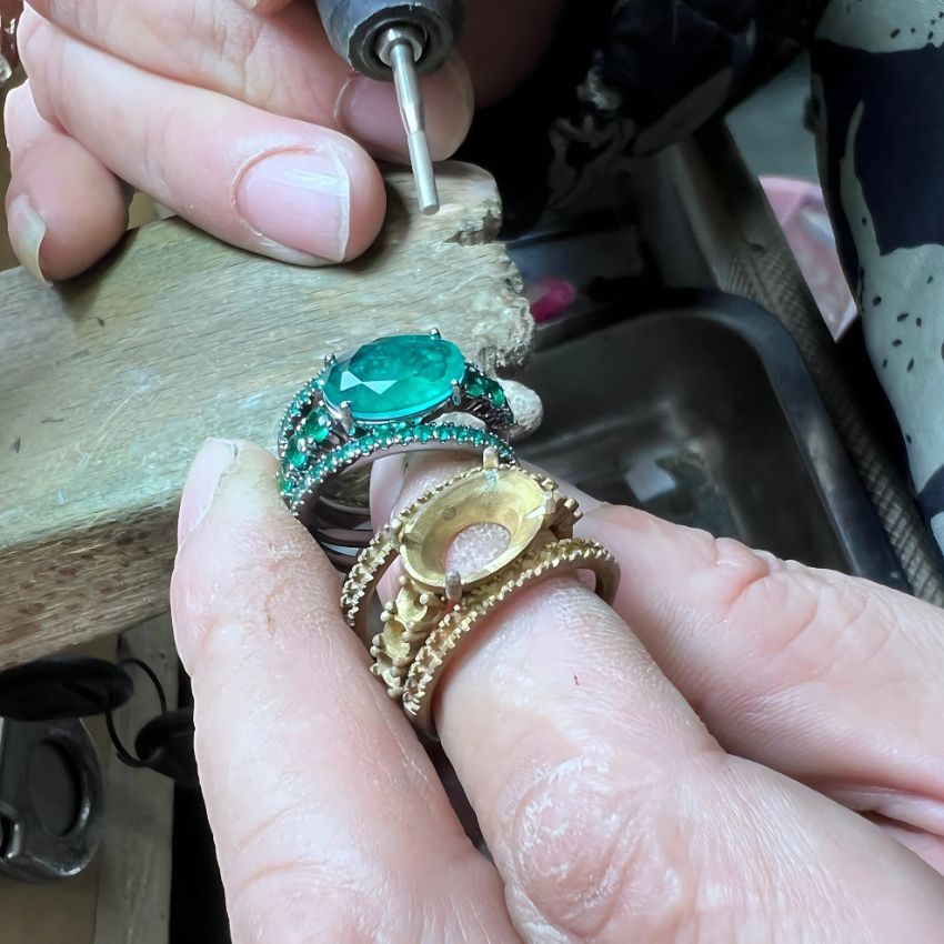 A skilled jeweler from JR Fashion Accessories meticulously crafting a custom ring, showcasing the precision jewelry molding process.