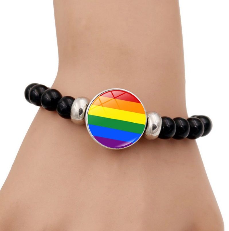 Close-up of the Rainbow LGBT Beads Adjustable Bracelet featuring a silver-plated chain and a colorful pride flag charm.