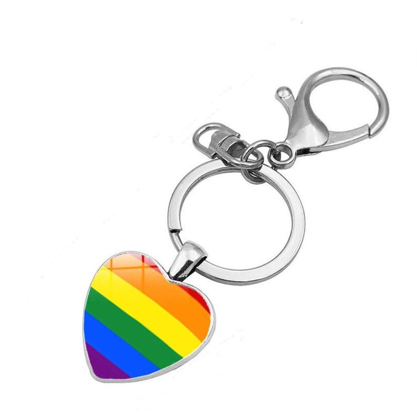 A close-up of the Rainbow LGBT Heart Key Chain, showcasing the vibrant enamel colors of the pride flag on a silver-plated stainless steel heart.