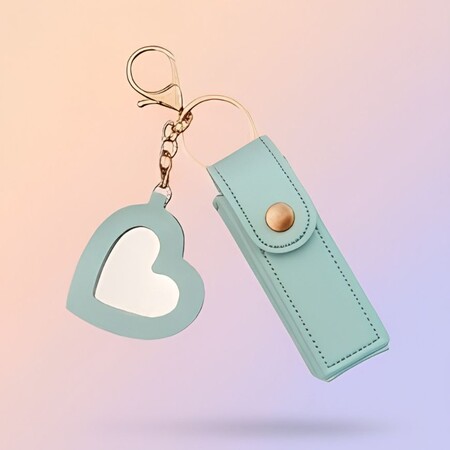 Mint green PU leather lipstick case keychain featuring a heart-shaped mirror charm.