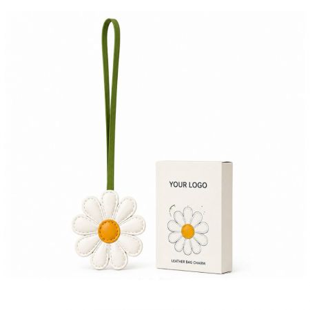 White daisy leather bag charm with custom logo promotional packaging box for corporate gifting.