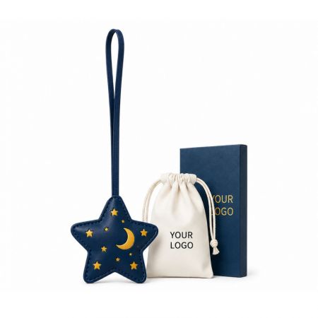 Star and moon leather bag charm with custom branded gift box and personalized dust bag packaging.