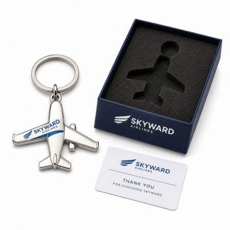 Metal airplane promotional keychain with airline logo custom fitted foam gift box and appreciation card.