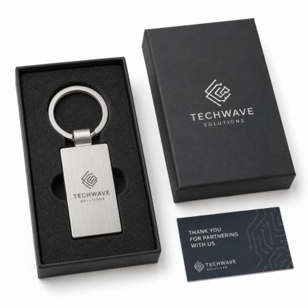 Brushed metal rectangular keychain laser engraved corporate tech logo premium gift box partner thank you card.