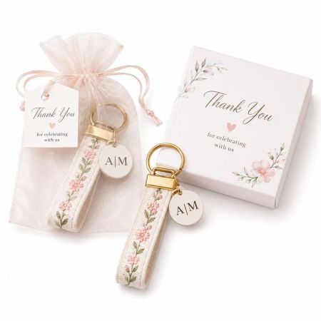 Embroidered fabric strap keychain with monogram charm organza bag thank you gift box wedding corporate favor.